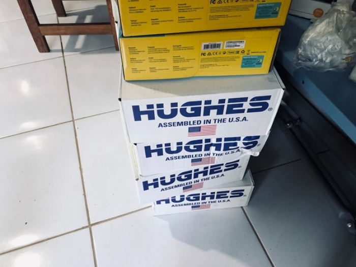 Humaitá City “Hughes Internet Service” boxes stacked on a floor