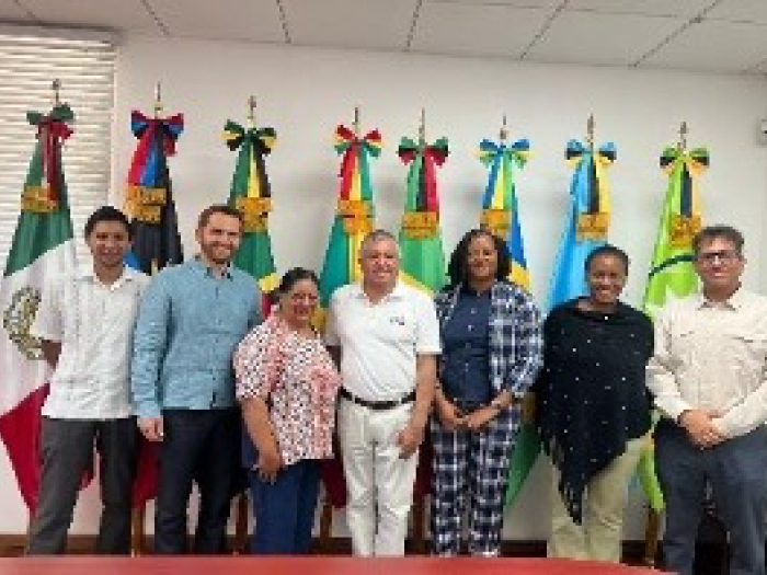 Group of people from the Mexican embassy visiting with government officials in St. Lucia